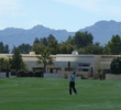 You'll play in the shadow of houses on a few holes at Omni Tucson National Sonoran Course.