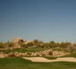 The first hole on the Pinnacle Course at Troon North Golf Club is a dogleg left, uphill to an elevated green. 