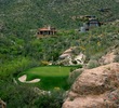 The famous third hole on the Mountain Course at Ventana Canyon Golf and Racquet Club in Tucson plays to a green set between two boulders. 