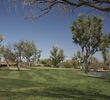 The Otero course's eighth hole is a par 3 played between mature trees.