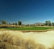 The finishing hole at Ak-Chin Southern Dunes Golf Club has a green that is well protected by bunkers and water.