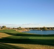 The 18th hole on the TPC Scottsdale Champions course is guarded by water at the green.