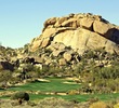 The Boulders Resort's signature hole is the par-5 fifth hole on the South Course, playing toward the mighty boulder pile. 