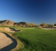 The 18th tee at McDowell Mountain Golf Club plays gently uphill to a green guarded by bunkers on either side.