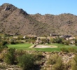 A large bunker guards the green on the par-3 17th, which can be played from two separate teeing grounds, alternated daily, at SunRidge Canyon Golf Club in Fountain Hills, Arizona.