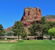 The red rocks of Sedona tower over the 11th green at Oakcreek Country Club in Sedona, Arizona.