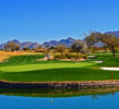 Water surrounds the back of the green on the par-3 12th at the TPC Scottsdale Stadium Course.