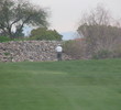 Coyote Lakes Golf Club - Phoenix Scottsdale - Golfer staring at stone wall on No. 6.