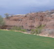 Canoa Ranch Golf Club's second hole has a huge rock wall at the turn.