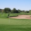 A view of a green protected by a tricky bunker at Stonecreek Golf Club.