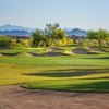 A sunny day view of a hole protected by a collection of bunkers from Palmer Course at Wildfire Golf Club at Desert Ridge.