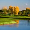 A fall view over the water of green at Stonecreek Golf Club