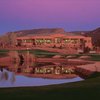 A view of fairway and green #8 with clubhouse in background at Sedona Golf Resort