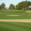 A view of green and clubhouse on the right at Arizona Traditions Golf Club