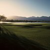 A sunny view of green with water coming into play at Vistoso Golf Club