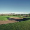 A view of green protected by bunkers at Vistoso Golf Club