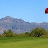 A view from green with mountains in background at Apache Creek Golf Club