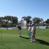 A view of a green with water fountain in background at Pueblo El Mirage Golf Club
