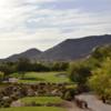 A view of a green flanked by sand traps at Boulders Golf Club & Resort
