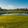 A sunny day view of a hole at Ocotillo Golf Club.