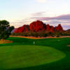 A view of a green and mountains in the distance at Papago Golf Course.