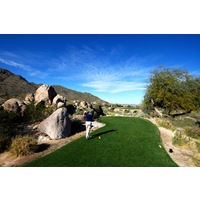 Many tee box locations at the SunRidge Canyon golf course feature large boulders beside them. 