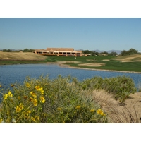 The finishing hole at the TPC Scottsdale Stadium Course features a large lake on the left side and plenty of fairway bunkers to challenge the tee shot.