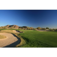 The 18th tee at McDowell Mountain Golf Club plays gently uphill to a green guarded by bunkers on either side.