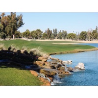 The finishing hole on the Padre Course at Camelback Golf Club, a 547-yard par 5, shares a lake with No. 9.