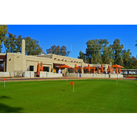 A putting green sits across the outdoor dining of the Adobe Restaurant at Arizona Biltmore Golf Club in Phoenix.