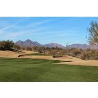 The par-4 12th hole on the Cholla Course at We-Ko-Pa Golf Club slides right to a well protected green.