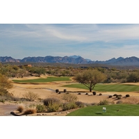 The finishing hole on the Cholla Course at We-Ko-Pa Golf Club features a great risk-reward tee shot where players can take on the left bunker, clear the tree or bail out right.